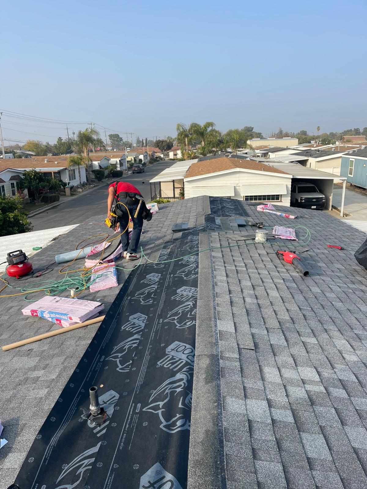 Asphalt shingle roof installation in progress by Luz Builders crew in Los Angeles