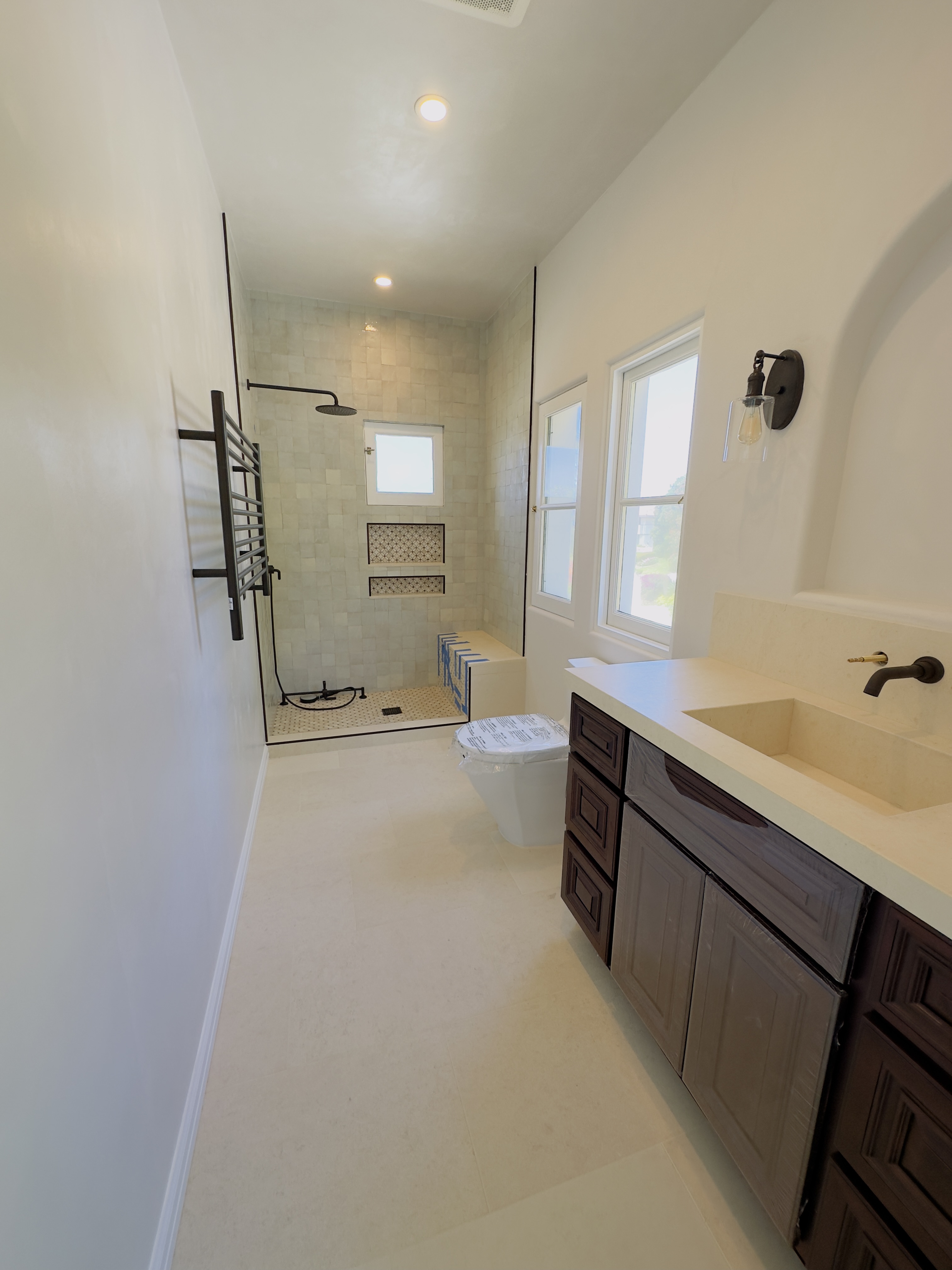 Dark wood vanity with zellige tile shower - Los Angeles