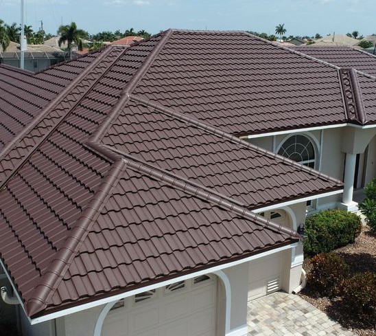 Clay tile roof installation with dark brown hip roof in Los Angeles