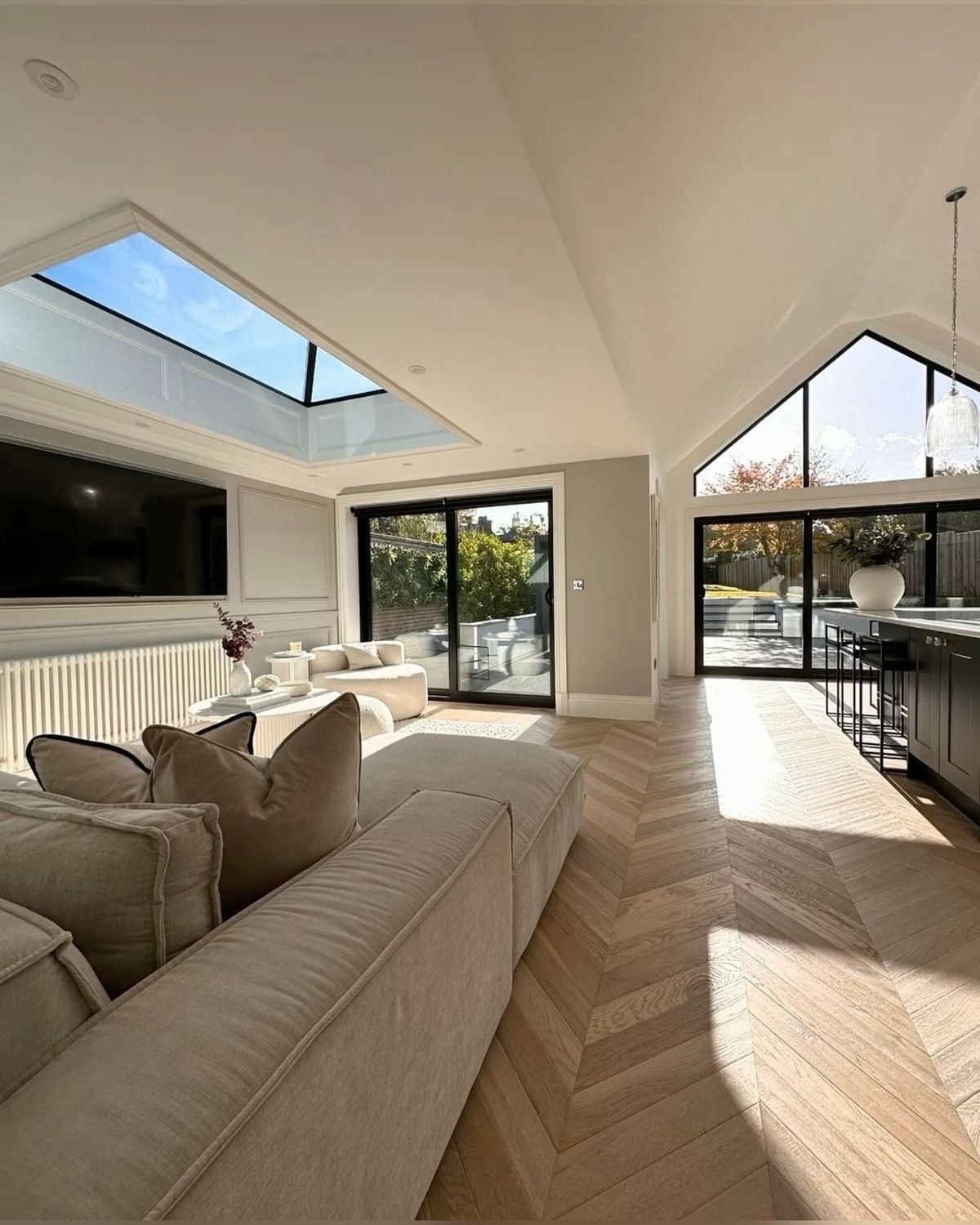 Completed room addition with skylight and chevron hardwood floors - Los Angeles