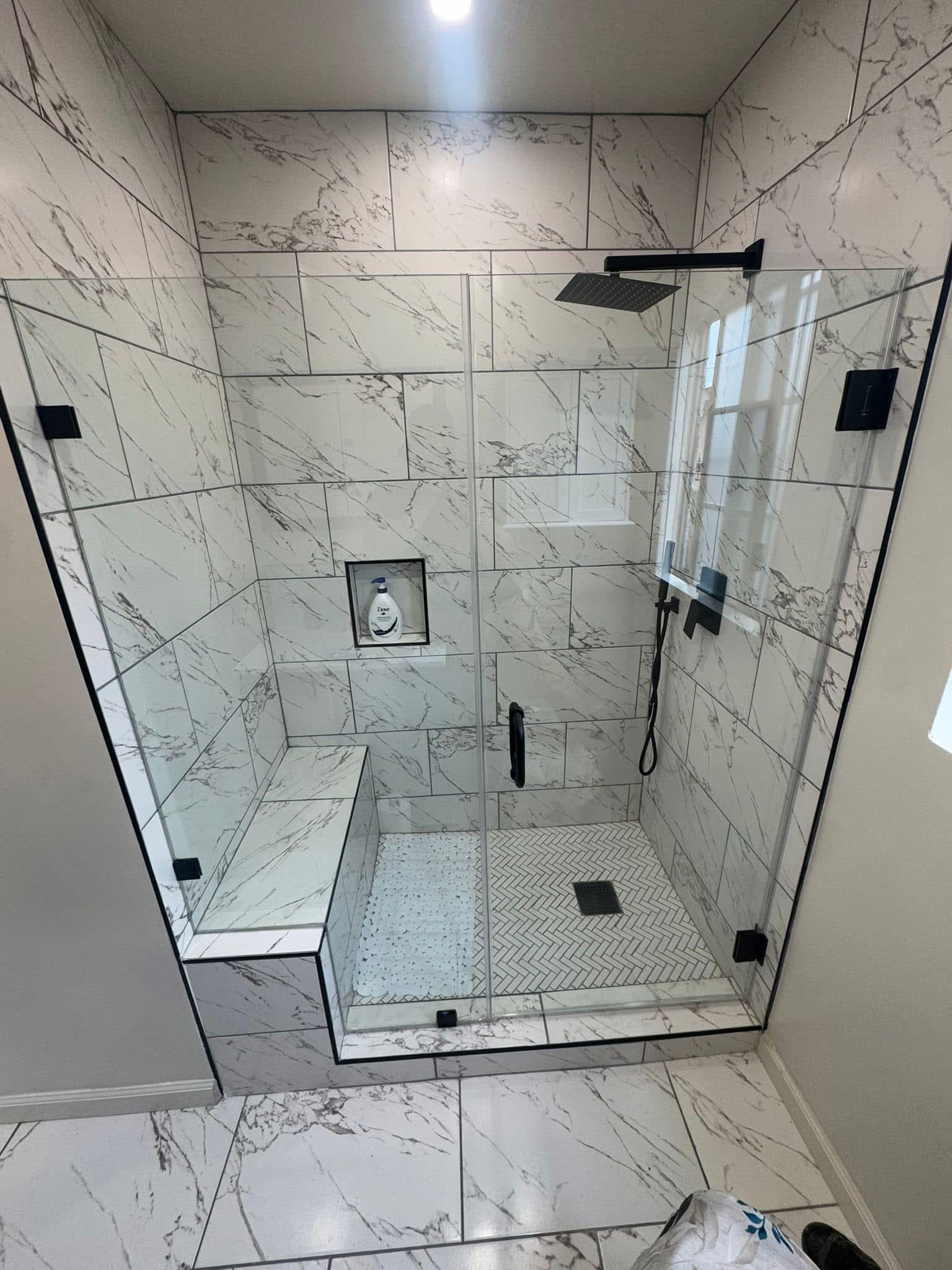Walk-in shower remodel with calacatta marble tile and frameless glass - Los Angeles